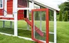 A close-up view of a red and white chicken coop with an open door and ramp. Produktbild-Vorschau