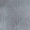 A close-up, textured view of a grey carpet with a geometric pattern. Anteprima dell’immagine prodotto