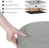 A hand pressing into a cushioned surface, with an illustration showing the layers of the material. Produktbild-Vorschau