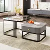 A modern living room with two coffee tables, a TV stand, and a rug. Voir les images du produit