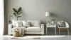 A minimalist living room scene with a sofa, chair, and side table. Produktbild-Vorschau