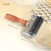 A pastry lattice roller is shown on a piece of dough, with dimensions indicated. Produktbild-Vorschau