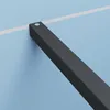 A close-up view of a black metal bracket attached to a light blue wall with a white line running horizontally behind it. Produktbild-Vorschau