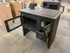 A black wood-burning stove with an open oven door and a stovetop. Anteprima dell’immagine prodotto
