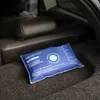 A moisture absorber packet sits on the carpeted floor of a car trunk, near the back seats. Voir les images du produit