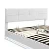A close-up view of a white upholstered bed frame with a slatted base and LED lighting. Produktbild-Vorschau