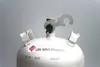 A close-up view of the top of a propane gas cylinder, showing the valve and a specialized wrench. Produktbild-Vorschau