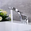 A chrome faucet with water running into a white sink, with a bouquet of white flowers to the left. Podgląd zdjęcia produktu