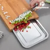 A person is chopping vegetables on a bamboo cutting board with a stainless steel tray underneath. Náhľad obrázku produktu