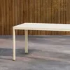 A beige outdoor dining table is shown in front of a slatted wooden wall. Podgląd zdjęcia produktu