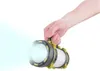 A hand holding a flashlight that is emitting a bright beam of light. Náhled obrázku produktu