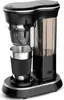 A studio shot of a coffee maker with a travel mug. Produktbild-Vorschau
