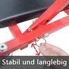 A close-up of a red metal frame with a black seat, showing a hand holding a metal ring attached to the frame. There are also bolts and a red arrow indicating movement. Náhľad obrázku produktu