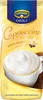 A pouch of Krüger Family White Cappuccino with vanilla flavor, showing a cup of cappuccino with foam. Produktbild-Vorschau
