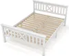 A white wooden bed frame with a slatted base, shown from a diagonal angle against a white background. Náhľad obrázku produktu