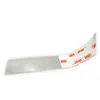 A close-up of a roll of 3M VHB tape with the backing paper partially removed. Produktbild-Vorschau