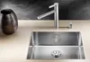 A modern kitchen sink with a faucet and a decorative vase. Podgląd zdjęcia produktu