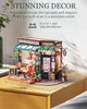 A miniature model of a bistro or restaurant displayed on a wooden surface. Produktbild-Vorschau