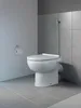 A white toilet with a silver bidet spray attachment in a tiled bathroom. Produktbild-Vorschau