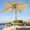An outdoor patio scene with a table, chairs, and an umbrella. Produktbild-Vorschau