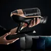 A person is holding a vacuum cleaner in a dark room. Produktbild-Vorschau