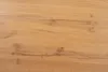 A close-up view of a wooden surface with visible grain and knots. Produktbild-Vorschau