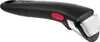 A close-up studio shot of a black cookware handle with a red button and silver attachment. Produktbild-Vorschau