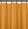 A close-up view of a mustard yellow curtain hanging from a black curtain rod. Náhled obrázku produktu