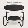 An exploded view diagram showing the assembly of a two-tiered round coffee table. Produktbild-Vorschau