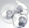 Three clear plastic suction cups are arranged in a group against a light gray and white background. Produktbild-Vorschau
