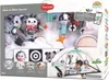 The image shows the packaging of a Tiny Love Black & White Gymini 2-in-1 play mat, with a baby interacting with the play mat inside the packaging. Náhled obrázku produktu