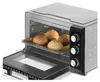 A toaster oven with the door open, showing a baking tray with four rolls inside. The oven is silver and black, with control knobs on the side. Náhled obrázku produktu
