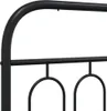 A close-up view of the black metal frame of a bed. Náhled obrázku produktu