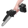A hand holding a mini chainsaw. Podgląd zdjęcia produktu