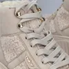 Close-up view of a beige Rieker boot. Voir les images du produit