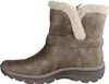 Side view of a single taupe-beige Skechers women's boot with cream-colored faux fur trim. Voir les images du produit