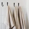 10 Stueck schwarze kleine Haken an der Wand montiert mit 20 Produktbild-Vorschau 6