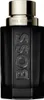 A black perfume bottle with gold accents and the brand name embossed on the front. Náhľad obrázku produktu