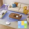 A clean and modern living room with furniture and a robotic vacuum cleaner. Produktbild-Vorschau