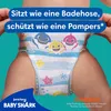 A close-up of a baby wearing Baby Shark themed swim diapers, with text overlays. Podgląd zdjęcia produktu