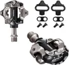 A set of bicycle pedals and cleats, presented on a white background. Produktbild-Vorschau