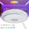 A modern LED ceiling light with integrated Bluetooth speaker, shown in a room with ambient purple lighting. Multiple color options for the light are displayed at the bottom. Produktbild-Vorschau