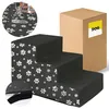 A three-step pet stair with a paw print pattern, next to its packaging box. Produktbild-Vorschau