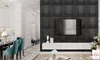 A modern living room and dining area with a TV mounted on a decorative wall. Produktbild-Vorschau