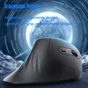 A dark, futuristic background with a glowing blue orb and light streaks, featuring a black ergonomic vertical mouse. Produktbild-Vorschau