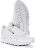 A pair of white Reebok sneakers shown from a slightly elevated angle, with one shoe in the foreground and the other behind it, displaying the sole. Voir les images du produit