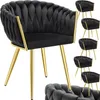 A collage of black velvet dining chairs with gold legs, featuring a tufted knot design. Náhled obrázku produktu