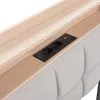 A close-up view of a headboard with integrated charging ports and a wooden shelf. Náhled obrázku produktu