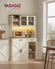 A white and wood sideboard with a microwave and coffee maker on top, set in a kitchen or dining room. Náhled obrázku produktu