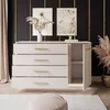 A modern dresser with drawers and a cabinet, decorated with dried flowers and artwork, in a stylish room setting. Náhled obrázku produktu